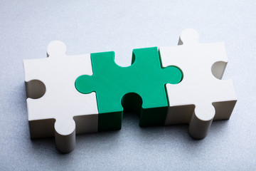 Fototapeta premium Jigsaw Puzzle Block On White Textured Background