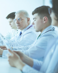 Medical team sitting and discussing at table