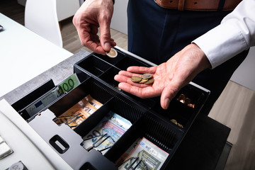 Euro Banknotes And Coins In Cash Box