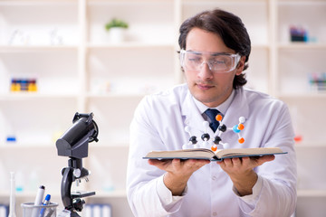 Young male scientist working in the lab 