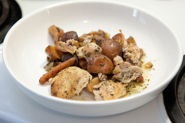 White bowl with fresh chicken stew with potato and carrot