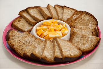 buttered sweet loaf with cheese on a tray