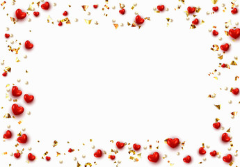 Background with red hearts and round beads strewn with golden confetti.