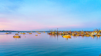 Ships and boats in the Provincetown Marina during sunset Provincetown, MA