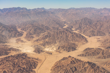 Fototapeta na wymiar Aerial view of the mountains and sandy plateau of Egypt. Sinai, Africa.