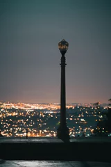 Fotobehang Romantic streetlamp at night over Los Angeles skyline background © Sono Creative