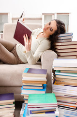 Young female student preparing for exams at home 