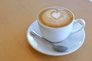 hot latte coffee drink put on wooden table in cafe restaurant, breakfast in the morning day