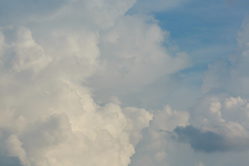 fluffy white cloud above clear blue sky background