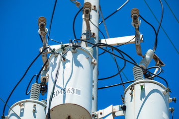 Electric pole with a transformer and wires