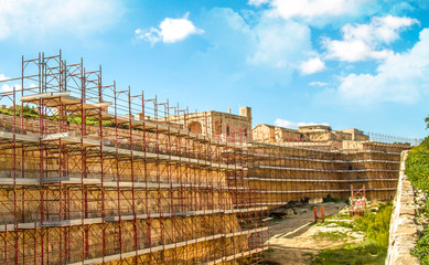 Ancient building fortress in scaffolding