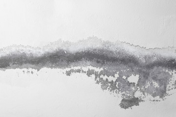 Cracked white wall with old layers of paint background