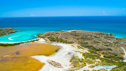 Aerial view of Puerto Rico. Faro Los Morrillos de Cabo Rojo. Playa Sucia beach and Salt lakes in Punta Jaguey. 