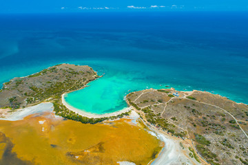 Aerial view of Puerto Rico. Faro Los Morrillos de Cabo Rojo. Playa Sucia beach and Salt lakes in Punta Jaguey. 
