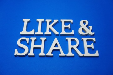 Like and Share alphabet letters on blue background