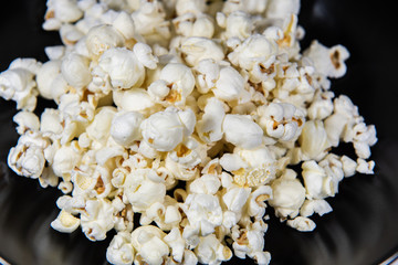 Popcorn in a plate on white background