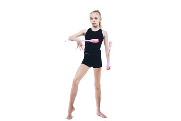 Teenager girl gymnast holds in hands clubs for rhythmic gymnastics