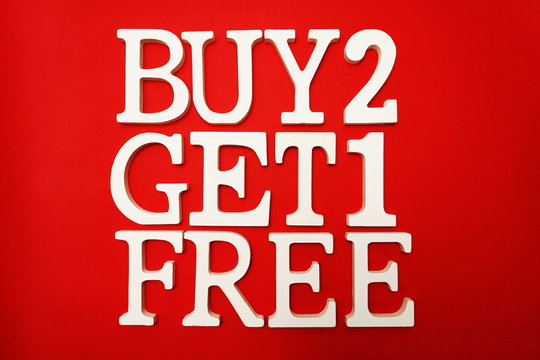 Buy two get one Free Sale Promotion on red background