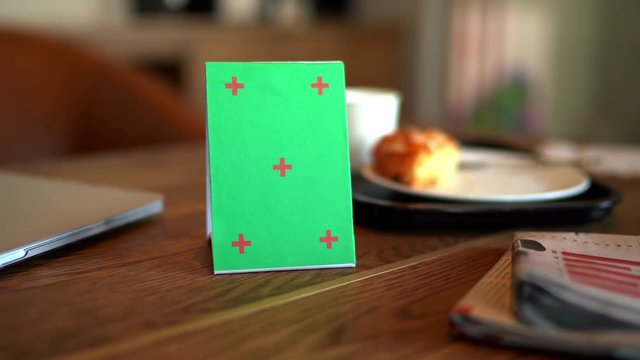 Mock up green signboard tent card menu with coffee cup