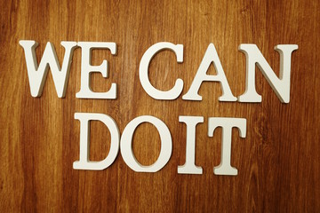 We can Do It  word alphabet letters on wooden background