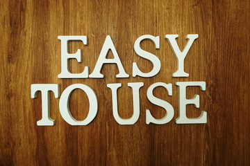 Easy To Use word alphabet letters on wooden background