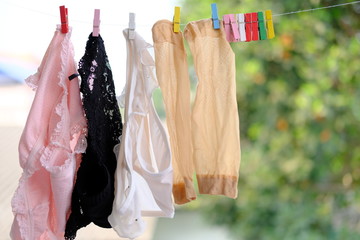 Clothes hanging on a clothesline and Women's panties dry on a hanger underwear