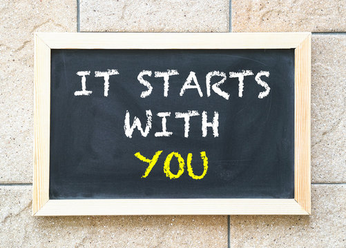 It starts with you, words on blackboard