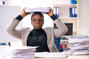 Black female employee unhappy with excessive work 