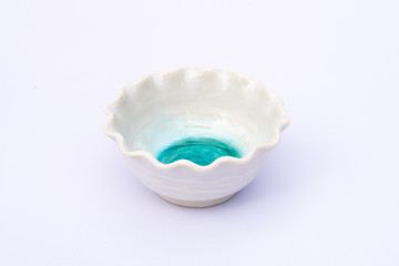 White bowl with serrated edge isolated on white background.