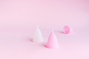 Menstrual cup on pink background. Alternative product