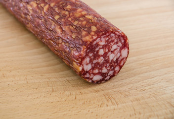 sausage smoked on a wooden background close-up