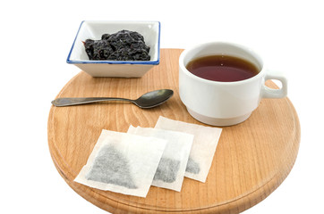 tea and jam on a wooden board and on a white background