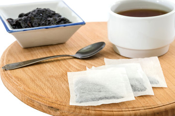 tea and jam on a wooden board and on a white background