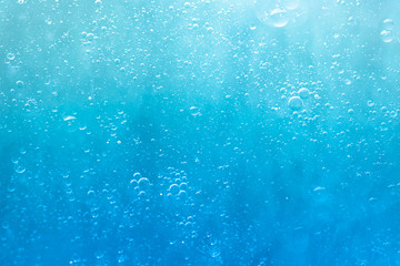 Air bubbles in the water background.Abstract oxygen bubbles in the sea.Circle foamy air in the...