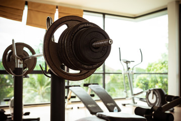 Obraz premium Empty fitness gymnasium with sport tools.Barbells for athlete exercise bodybuilding before match
