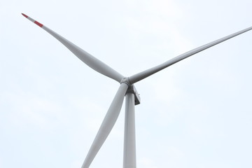 wind energy windmills in a dark storm, electric generators