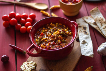 Chile con carne and ingredients for him. Mexican cuisine