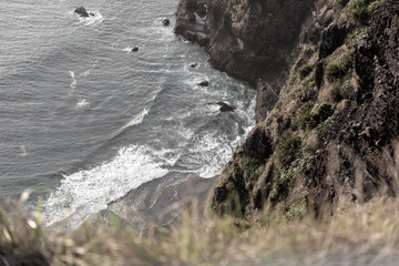 Coast waves bottom of cliff