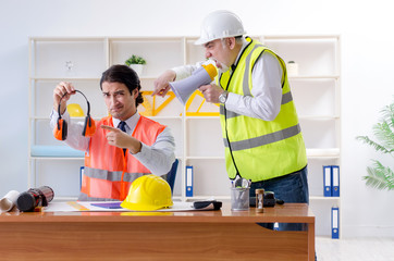 Two engineers colleagues working under project 