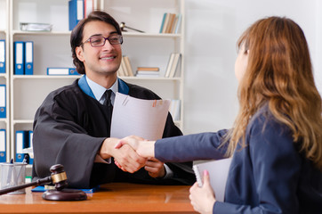 Young woman visiting male lawyer 