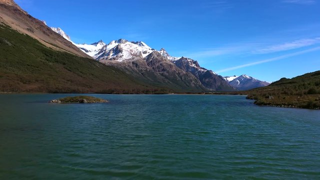 Aerial drone flight over the blue mountain lake. Los Glaciares National Park, Patagonia