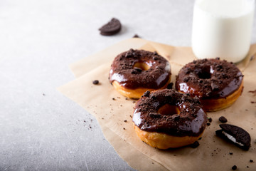 Pastries concept. Donuts with chocolate glaze and chocolate cookies