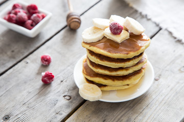 Sweet Homemade Stack of Pancakes with Butter and Honey for Breakfast