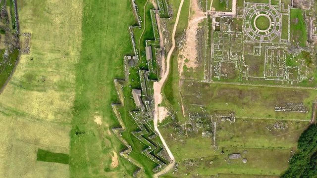 Aerial top view of the inca ruins of Sacsayhuaman on the outskirts of Cusco, Peru. Bird eye view of archaeological site, an ancient Inca citadel.
