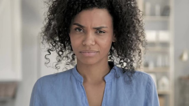 No, African Woman Rejecting Offer by Shaking Head