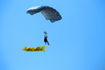 Soldiers show parachuting to allow children to watch on National Children's Day.