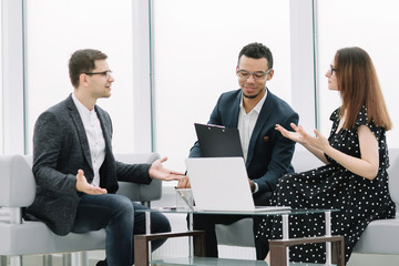 lawyer discusses the terms of the contract with the young couple.