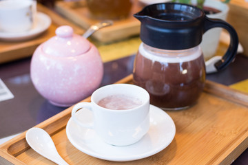 hot dark milk chocolate cup with teapot - 259854816