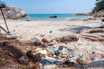 a lot of trash on a beautiful tropical beach. Waste problems, nature pollution with plastic....