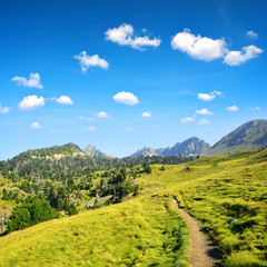 Naklejka premium Hiking trail in beautiful mountain landscape, Neouvielle national nature reserve, French Pyrenees.